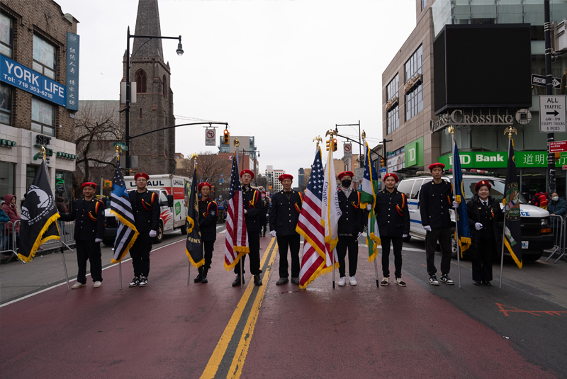IPVF honor guard carrying American flags during Flushing parade ceremony